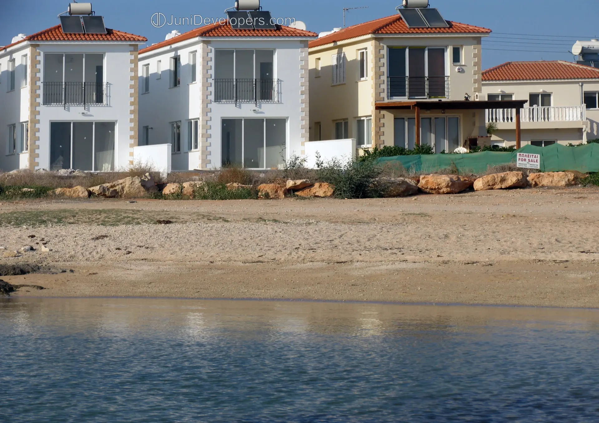 Beachfront villa in Ayia Napa resort area with large swimming pool and sandy beach access