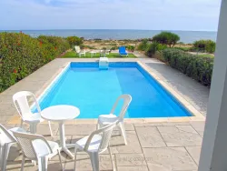 Beachfront villa in Ayia Napa resort area with title deeds and sandy beach