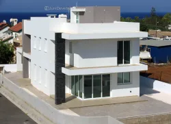 Sophisticated spacious villa in Pernera seafront with garage and a generous pool